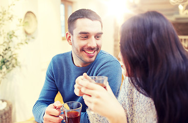 Image showing happy couple drinking tea at cafe