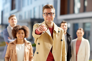 Image showing businessman pointing finger over people on street
