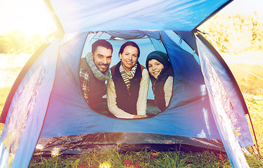 Image showing happy family in tent at camp site