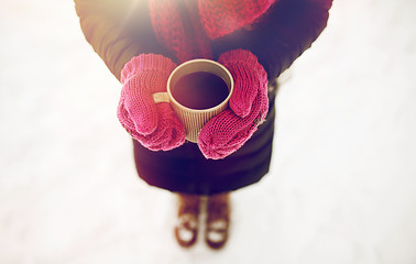 Image showing close up of woman with tea mug outdoors in winter