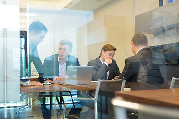 Image showing Business people sitting and brainstorming at corporate meeting.