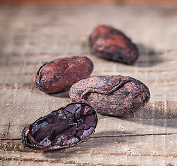 Image showing Cocoa beans on a wooden table