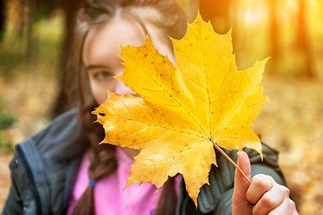 Image showing Young girl in a blurry background