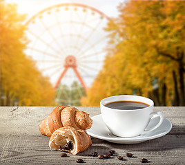 Image showing Cup of coffee with croissants