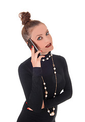 Image showing Business woman talking on cell phone.