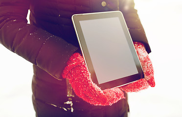 Image showing close up of woman with tablet pc in winter