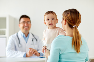 Image showing happy woman with baby and doctor at clinic