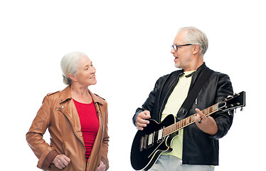 Image showing happy senior couple with electric guitar