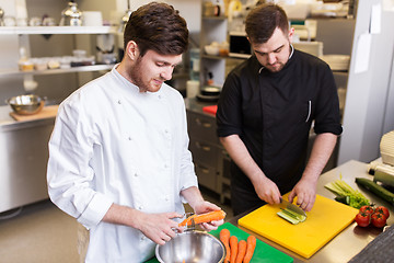 Image showing chef and cook cooking food at restaurant kitchen