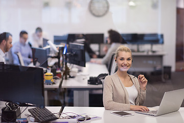 Image showing businesswoman using a laptop in startup office