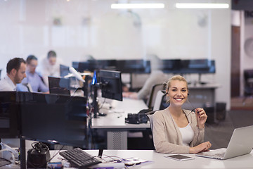 Image showing businesswoman using a laptop in startup office