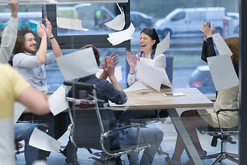 Image showing startup Group of young business people throwing documents