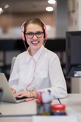 Image showing businesswoman using a laptop in startup office