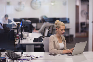 Image showing businesswoman using a laptop in startup office