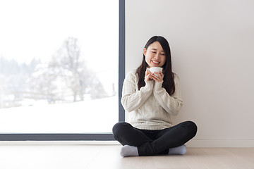 Image showing asian woman enjoying morning coffee