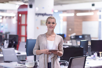 Image showing Business Woman Using Digital Tablet in front of startup Office