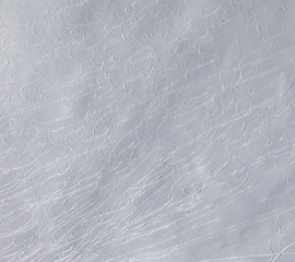Image showing Off-piste slope with traces of skis and snowboarding.