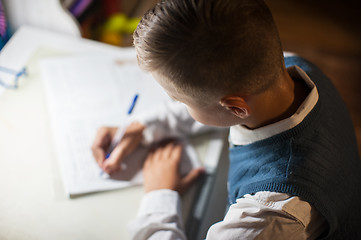 Image showing pupil boy does his homework