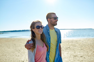 Image showing happy couple hugging on summer beach