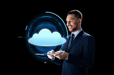 Image showing businessman with tablet pc and cloud projection