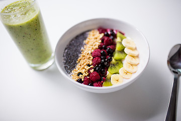 Image showing smoothie and bowl of yogurt with fruits and seeds