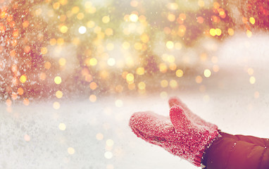 Image showing close up of woman throwing snow outdoors
