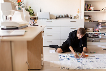 Image showing fashion designer making dress at sewing studio