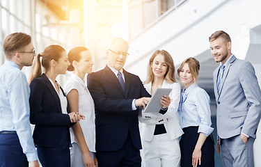 Image showing business people with tablet pc computer at office