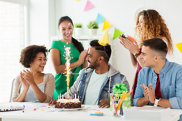 Image showing team greeting colleague at office birthday party