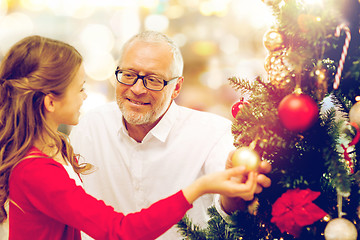 Image showing grandfather and granddaughter at christmas tree