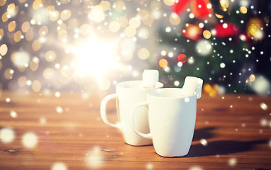 Image showing cups of hot chocolate with marshmallow on wood