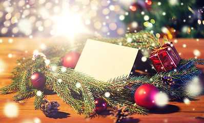 Image showing natural green fir wreath with note on wooden board