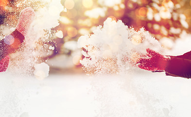 Image showing happy friends playing with snow in winter