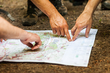 Image showing Navigating with map and compass