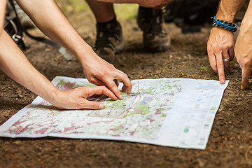 Image showing Navigating with map and compass