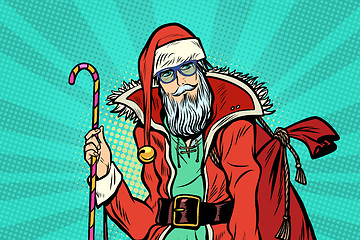 Image showing Hipster Santa Claus with sweets and Christmas gift