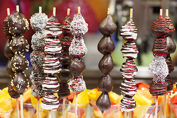 Image showing Chocolate dipped strawberries on market in Barcelona