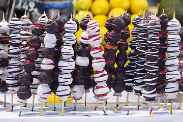 Image showing Chocolate dipped strawberries on market in Barcelona