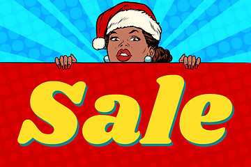 Image showing African Santa girl and sales poster