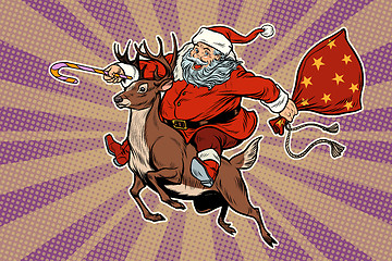 Image showing Santa Claus rides on deer