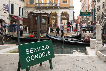 Image showing People entering the typical gondolas of Venice, Italy