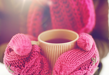 Image showing close up of woman with tea mug outdoors in winter