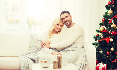 Image showing happy couple at home with christmas tree