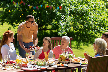 Image showing happy family having dinner or summer garden party