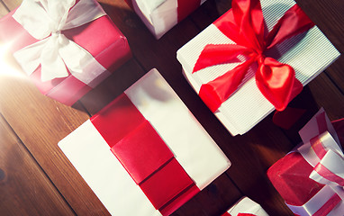 Image showing close up of gift boxes on wooden floor from top