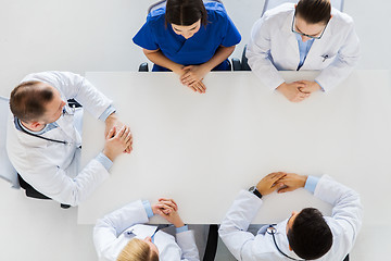 Image showing group of doctors sitting at empty table