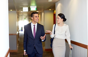 Image showing business team with travel bags at hotel corridor