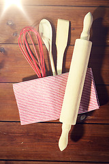 Image showing close up of kitchenware for baking on wooden board