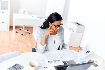 Image showing businesswoman with laptop working at office