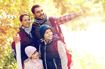 Image showing happy family with backpacks hiking